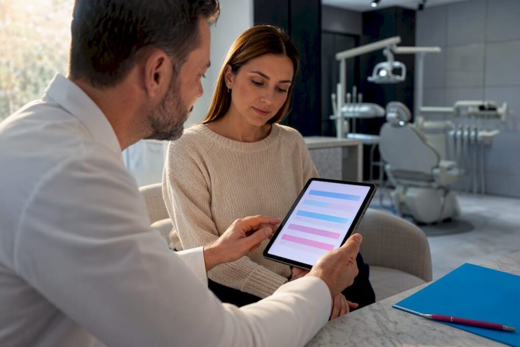 Dentist and patient reviewing extraction estimate