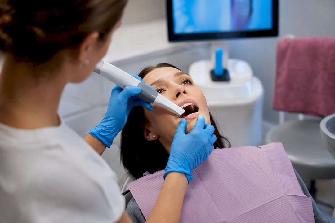 Clinician performing digital dental scan